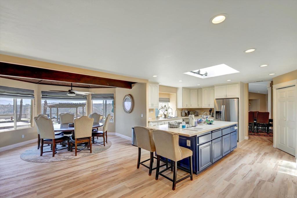 36485 Carney Road Valley Center, CA 92082 - Photo 20 of 75 a living room with stainless steel appliances kitchen island granite countertop furniture and wooden floor