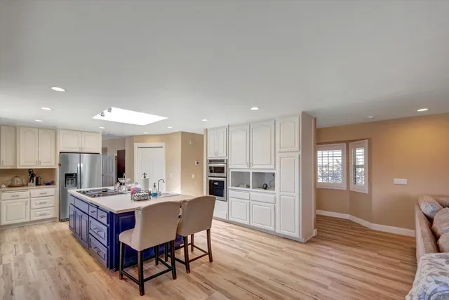 a spacious bathroom with a double vanity sink and a mirror
