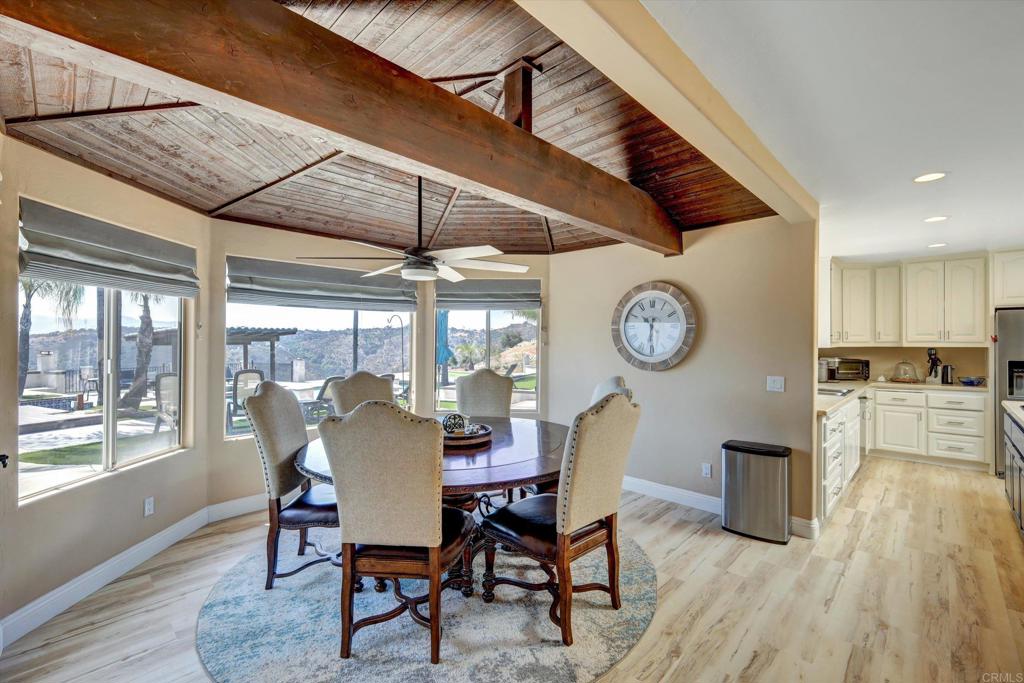 36485 Carney Road Valley Center, CA 92082 - Photo 24 of 75 a dining room with furniture a chandelier and wooden floor