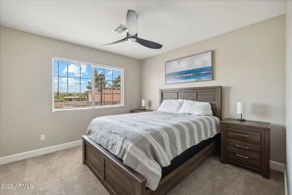 a bedroom with a bed and window