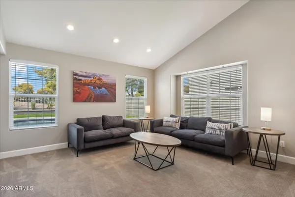 a living room with furniture and a window