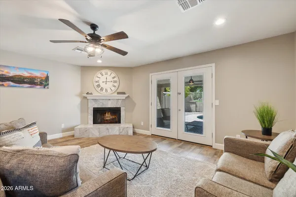 a living room with furniture and a fireplace