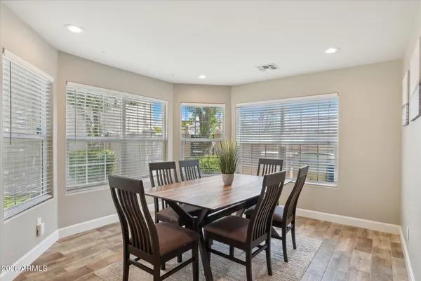 a view of a dining room with furniture and wooden floor