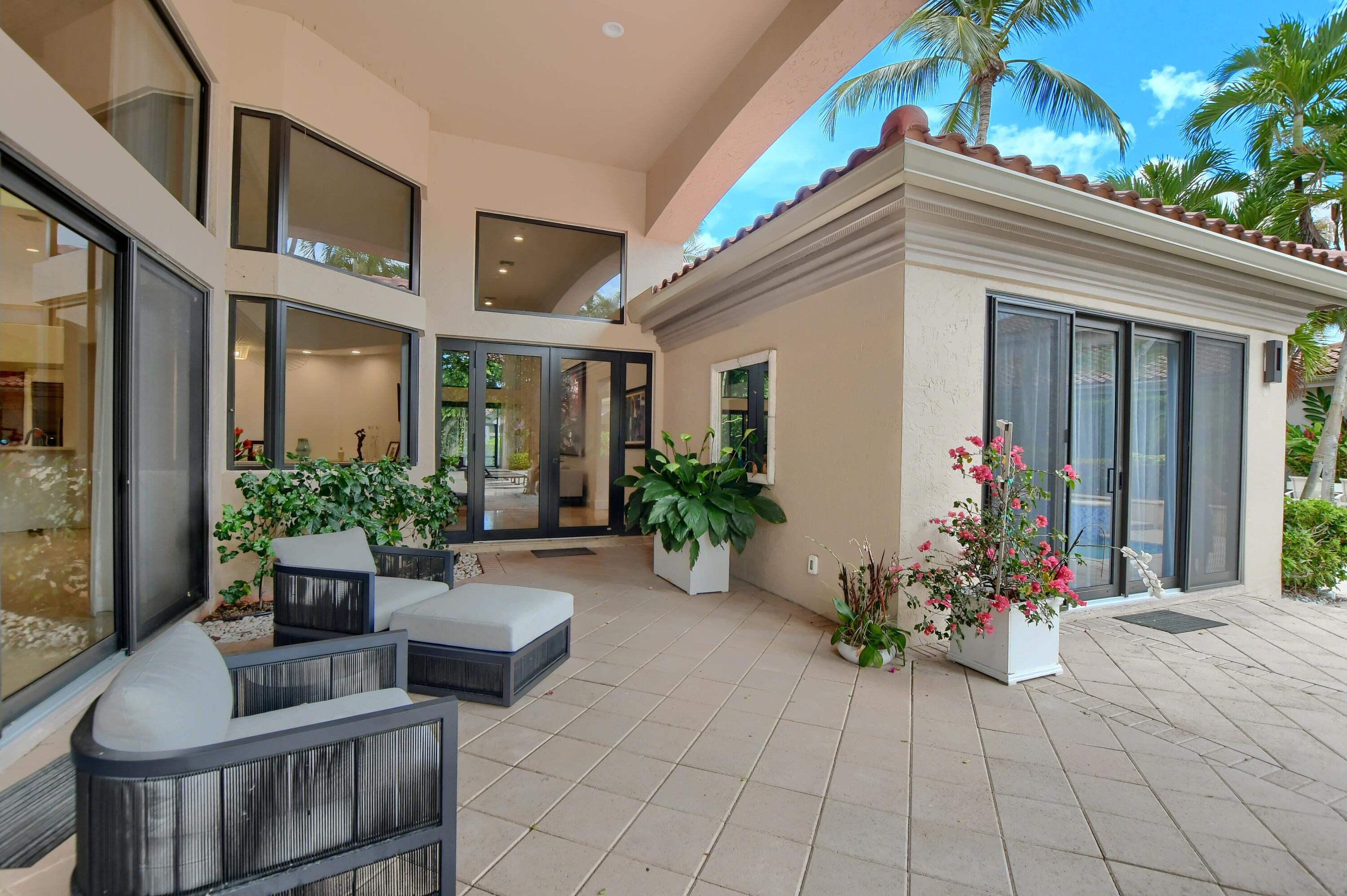 5894 Northwest 25th Court Boca Raton, FL 33496 - Photo 6 of 46 main home walkway
