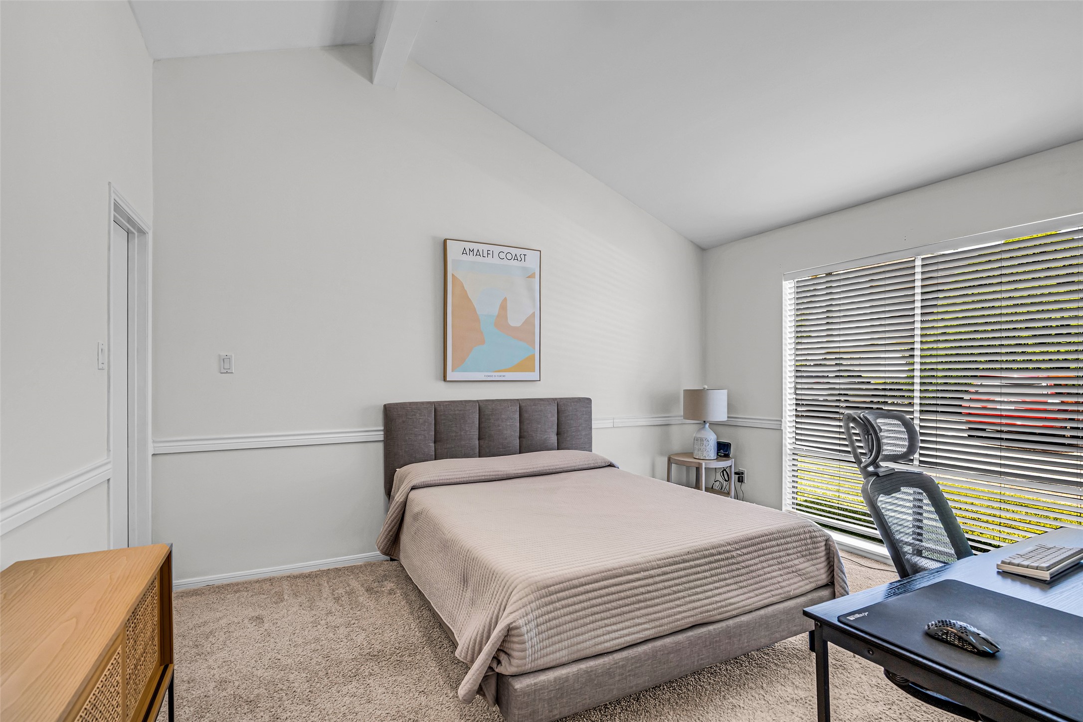 62 April Point Drive North Conroe, TX 77356 - Photo 21 of 25 a bedroom with a bed and wooden floor