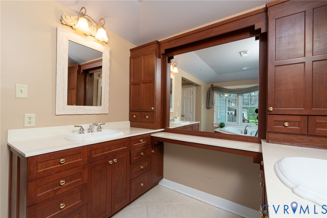 11920 Rothbury Drive Richmond, VA 23236 - Photo 25 of 68 a en suite bathroom with a sink double vanity and a mirror