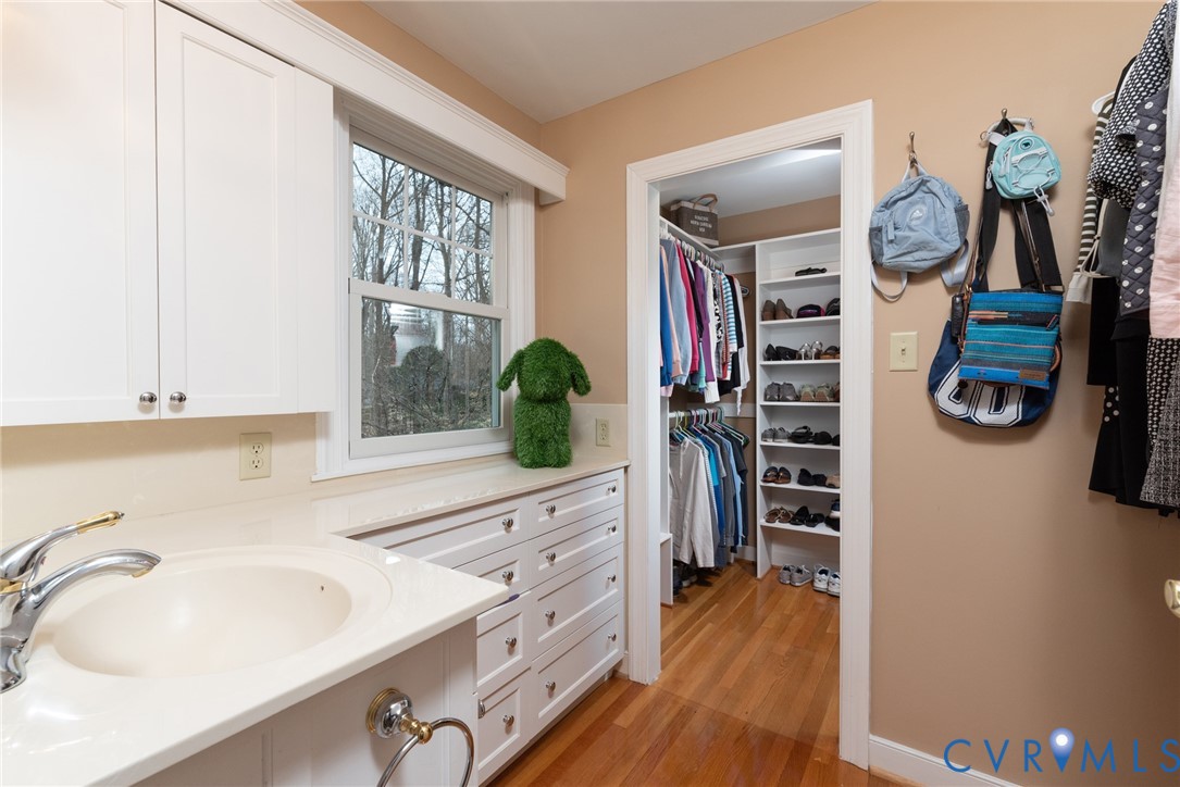 11920 Rothbury Drive Richmond, VA 23236 - Photo 28 of 68 a bathroom with a sink a mirror and shower