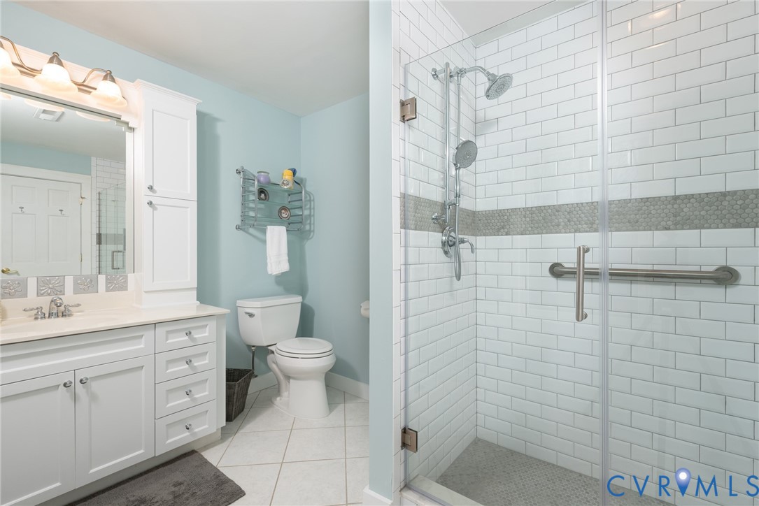11920 Rothbury Drive Richmond, VA 23236 - Photo 36 of 68 a bathroom with a toilet sink and shower
