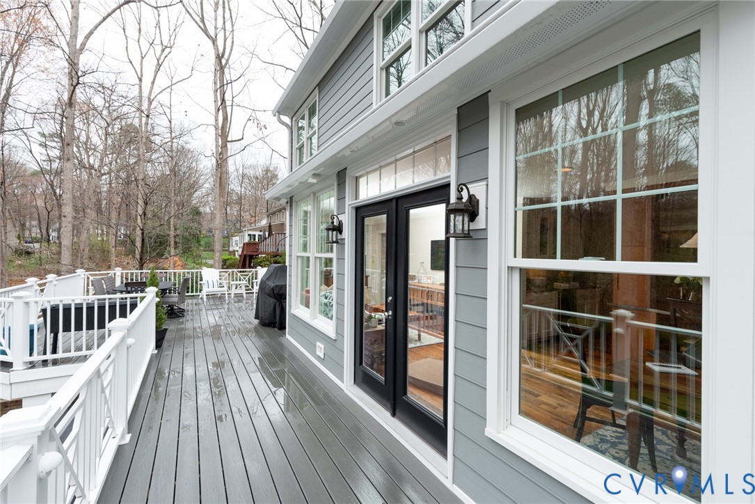 11920 Rothbury Drive Richmond, VA 23236 - Photo 44 of 68 a view of a balcony with chairs and wooden floor