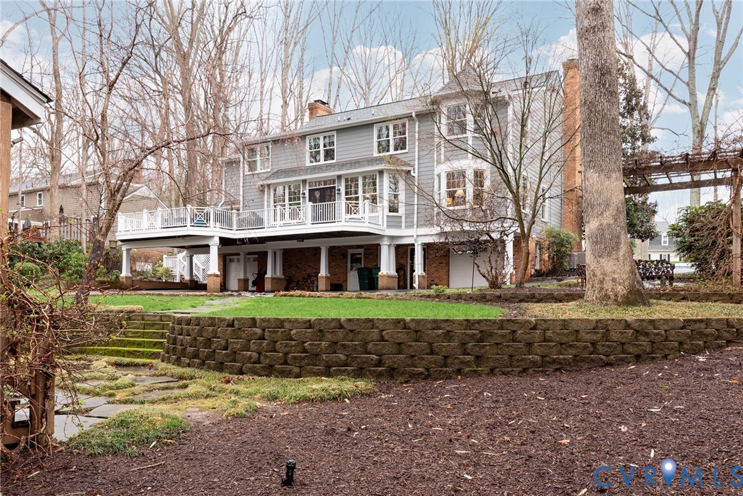 11920 Rothbury Drive Richmond, VA 23236 - Photo 54 of 68 a view of a big house with a big yard and large trees