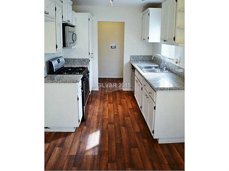 2520 Rialto Road Las Vegas, NV 89108 - Photo 10 of 35 Kitchen. New Laminate Flooring, New Paint, Fixtures and counters