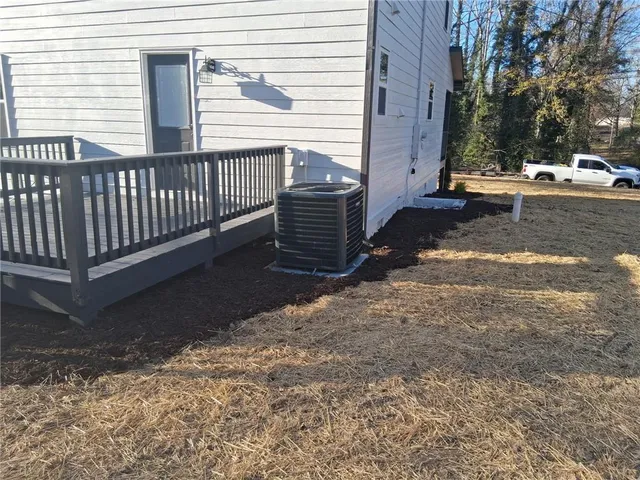 a view of a deck with a yard