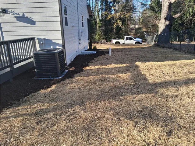 a view of a yard with trees