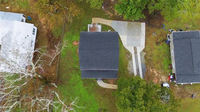 an aerial view of residential house with outdoor space