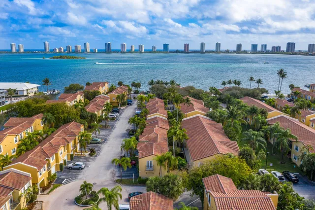 an aerial view of residential building and lake