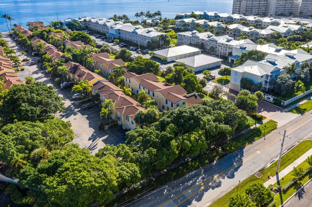 an aerial view of residential houses with outdoor space