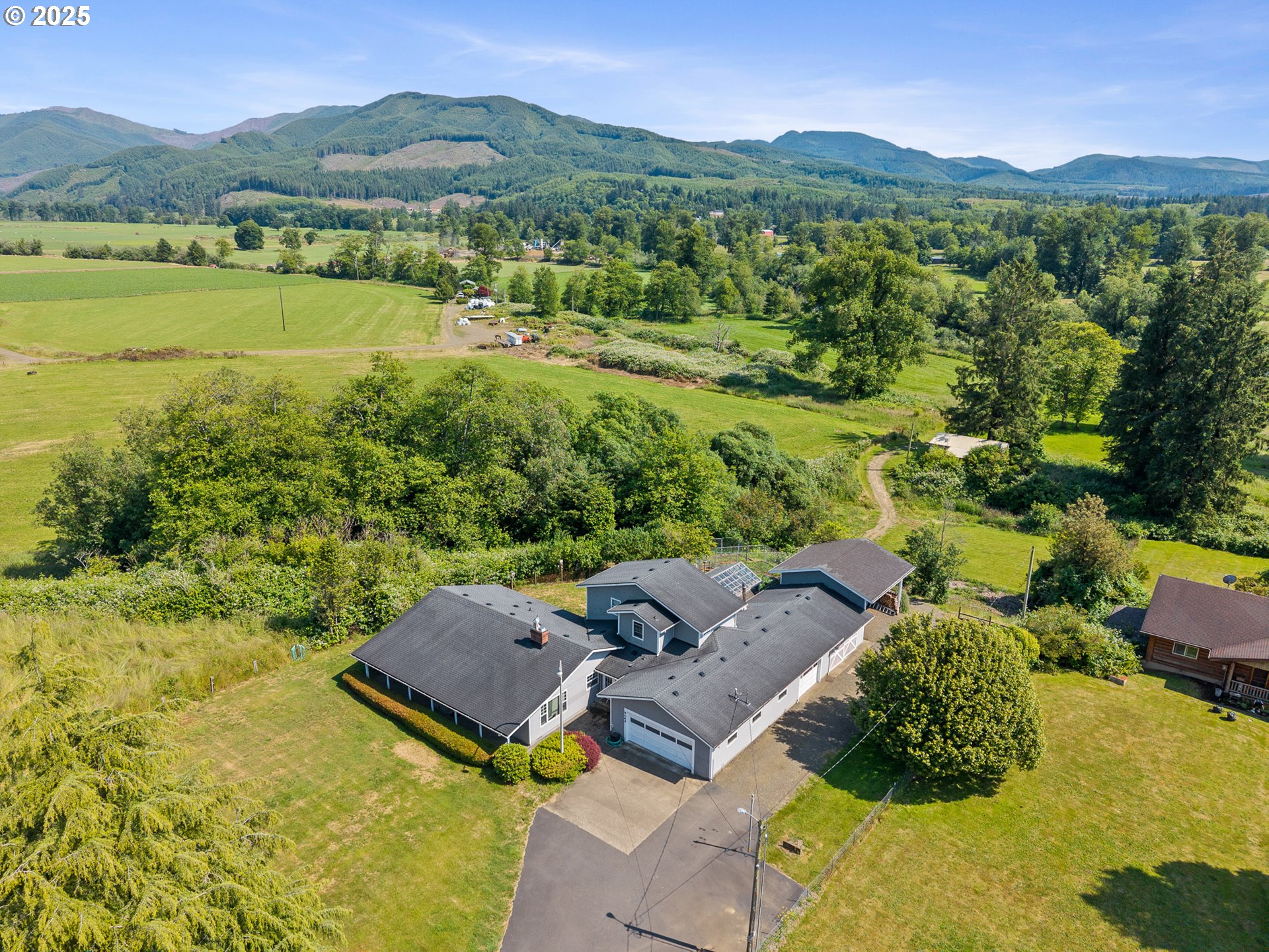 a view of a city with mountains in the background