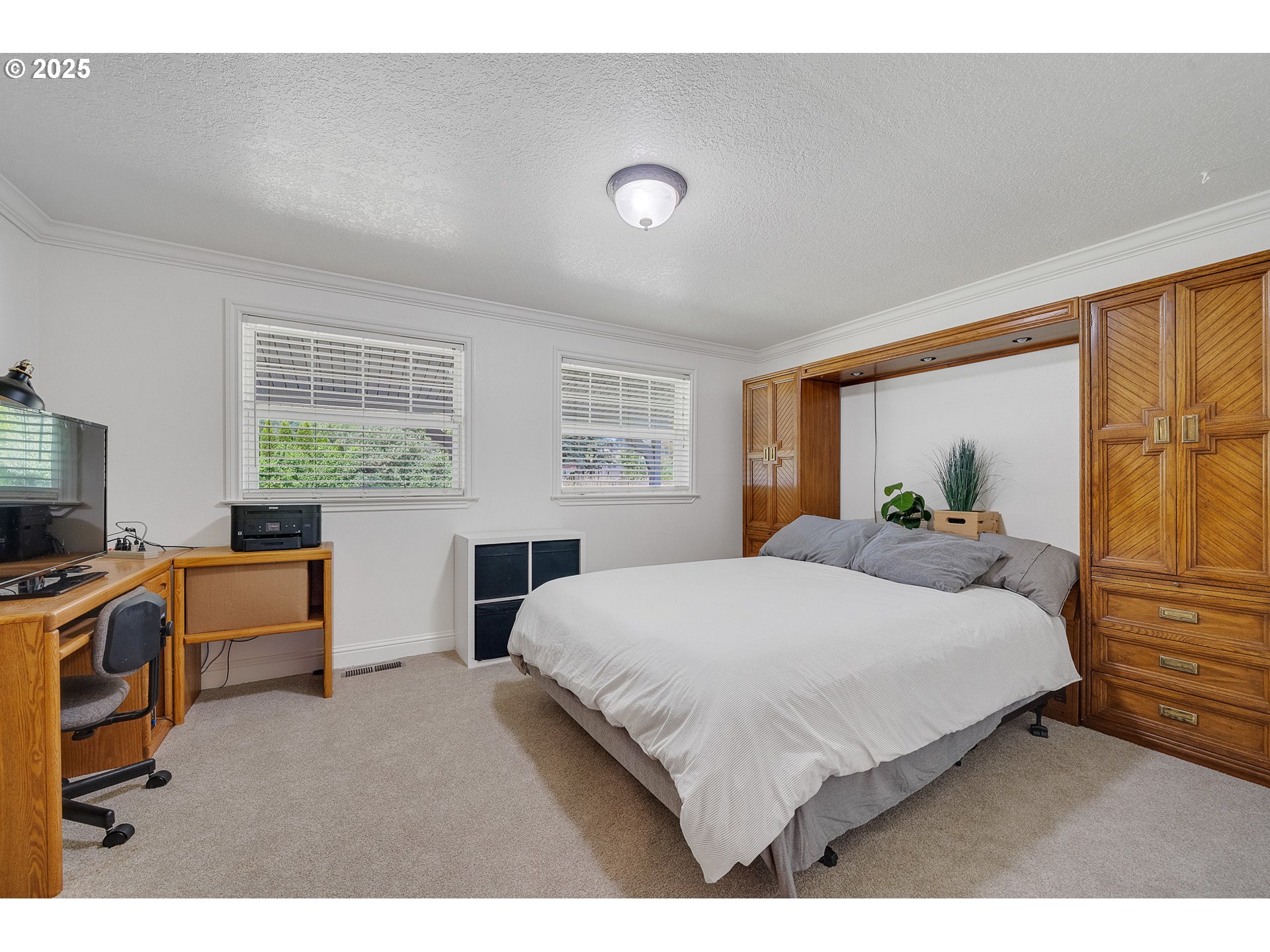 9065 Trask River Road Tillamook, OR 97141 - Photo 15 of 48 a bedroom with a bed and wooden floor