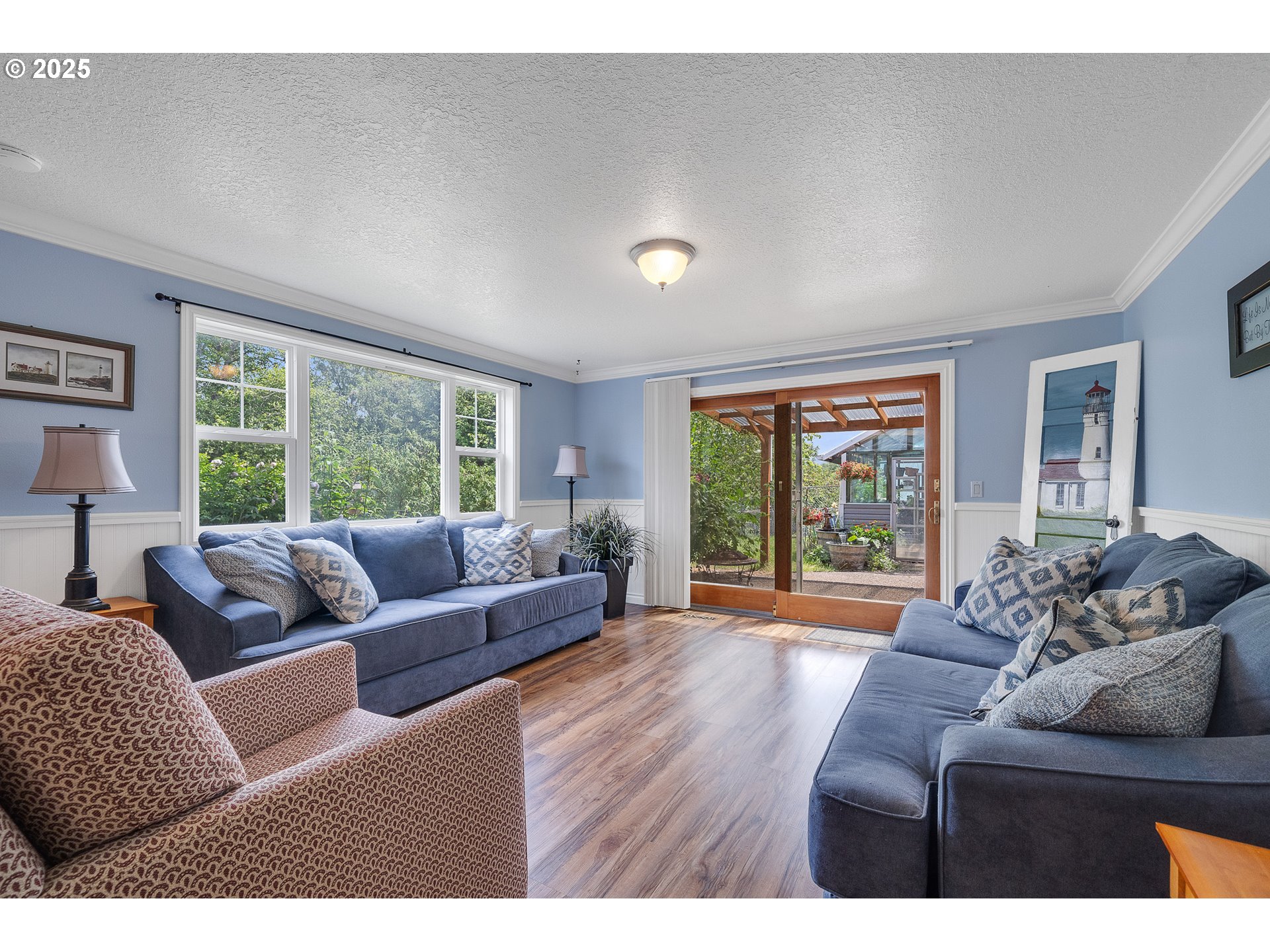 9065 Trask River Road Tillamook, OR 97141 - Photo 18 of 48 a living room with furniture and a large window