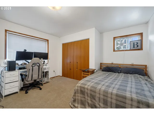 a bedroom with a bed and a view of bedroom