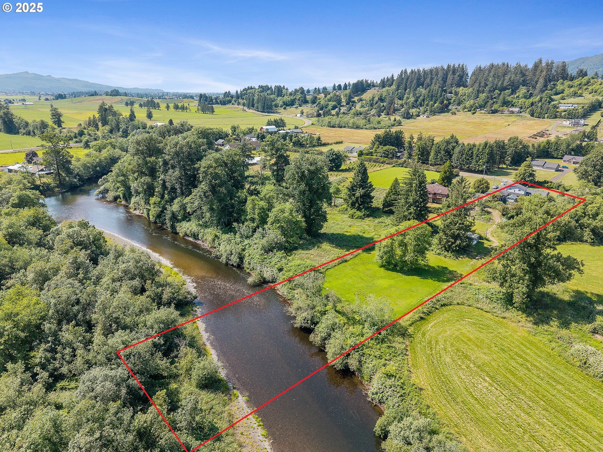 9065 Trask River Road Tillamook, OR 97141 - Photo 3 of 48 a view of a city with an ocean
