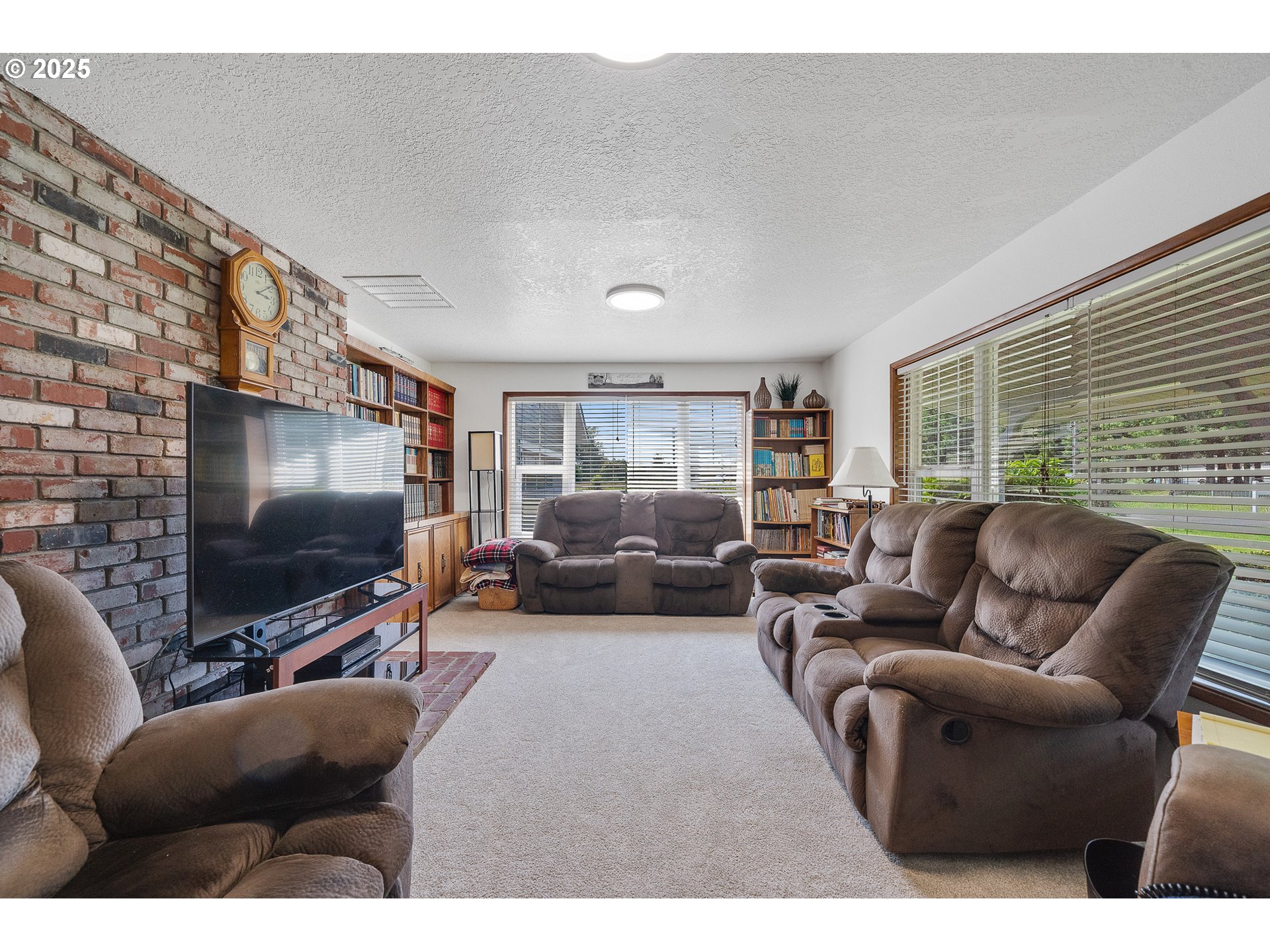 9065 Trask River Road Tillamook, OR 97141 - Photo 31 of 48 a living room with furniture and a flat screen tv