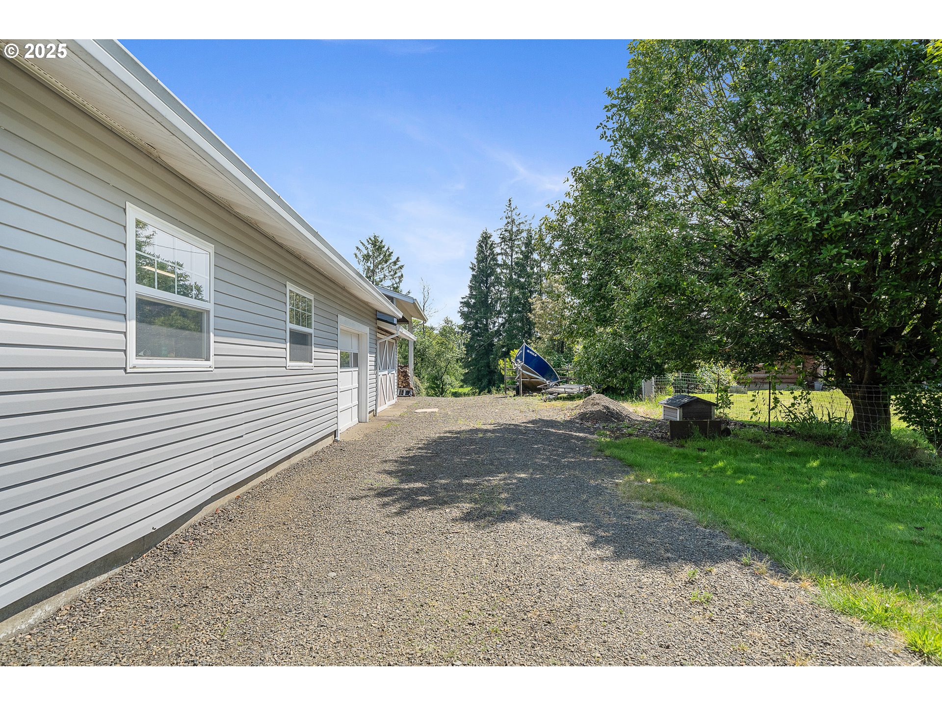 9065 Trask River Road Tillamook, OR 97141 - Photo 33 of 48 a view of a backyard with large trees