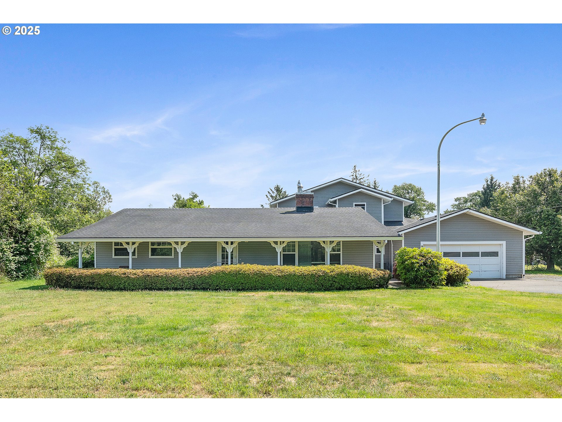 9065 Trask River Road Tillamook, OR 97141 - Photo 35 of 48 a front view of a house with a yard
