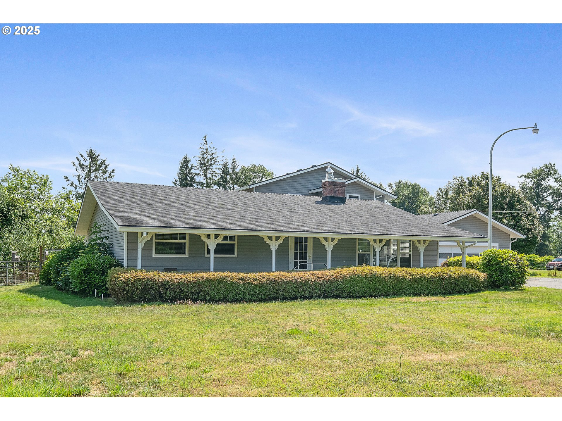 9065 Trask River Road Tillamook, OR 97141 - Photo 36 of 48 a front view of a house with a garden