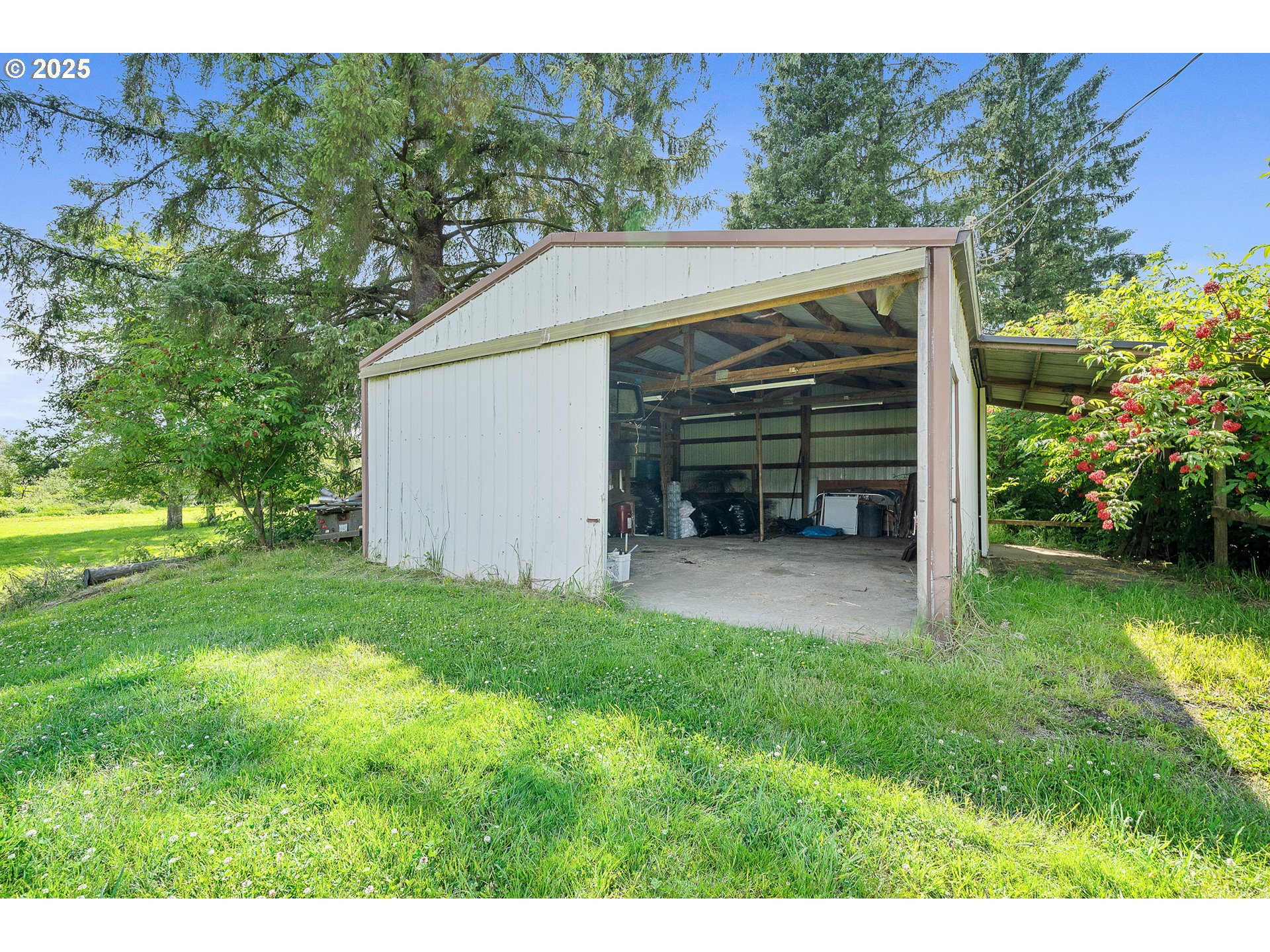 9065 Trask River Road Tillamook, OR 97141 - Photo 39 of 48 a view of a house with backyard and garden