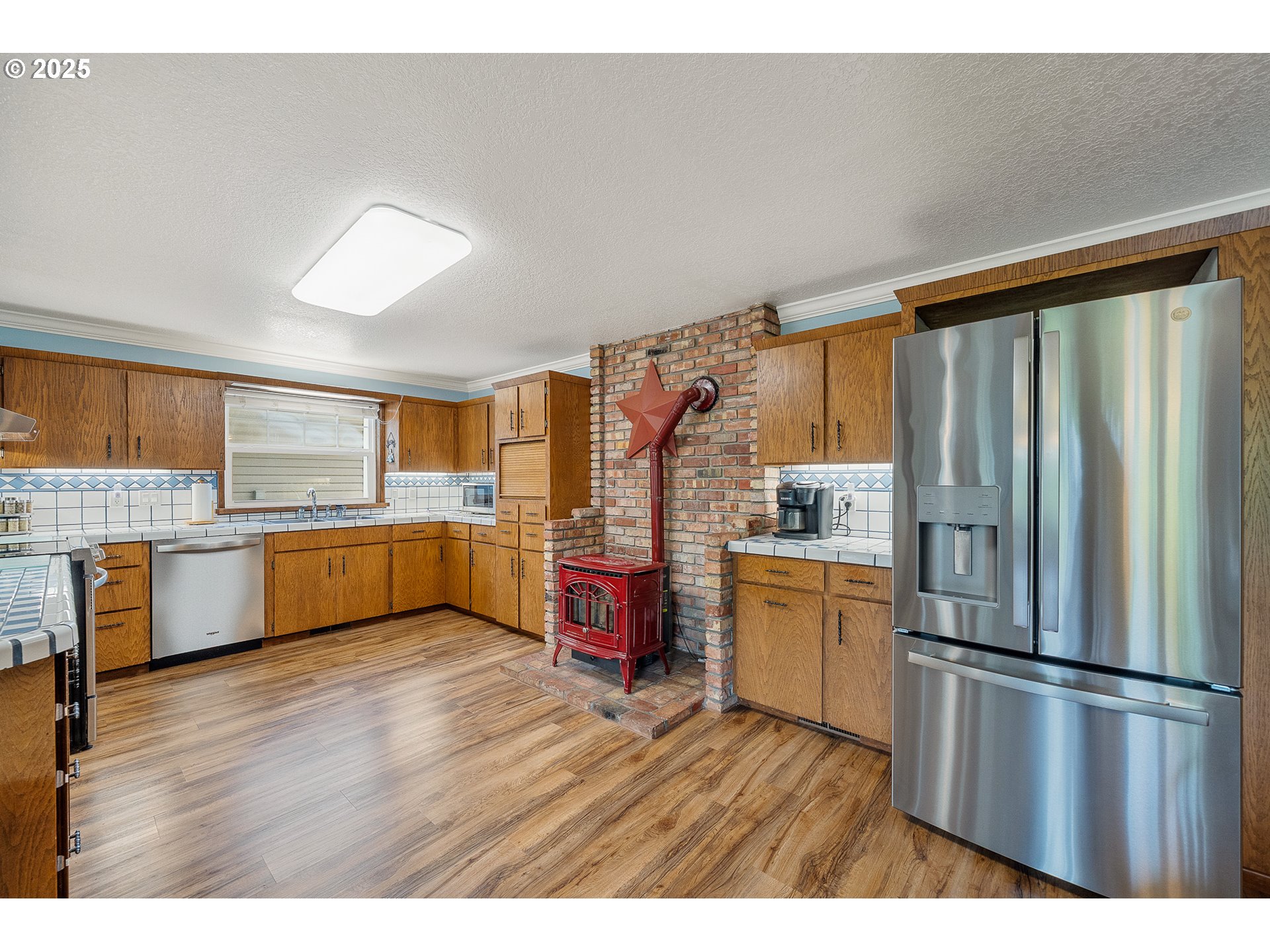 9065 Trask River Road Tillamook, OR 97141 - Photo 7 of 48 a kitchen with a refrigerator and a sink