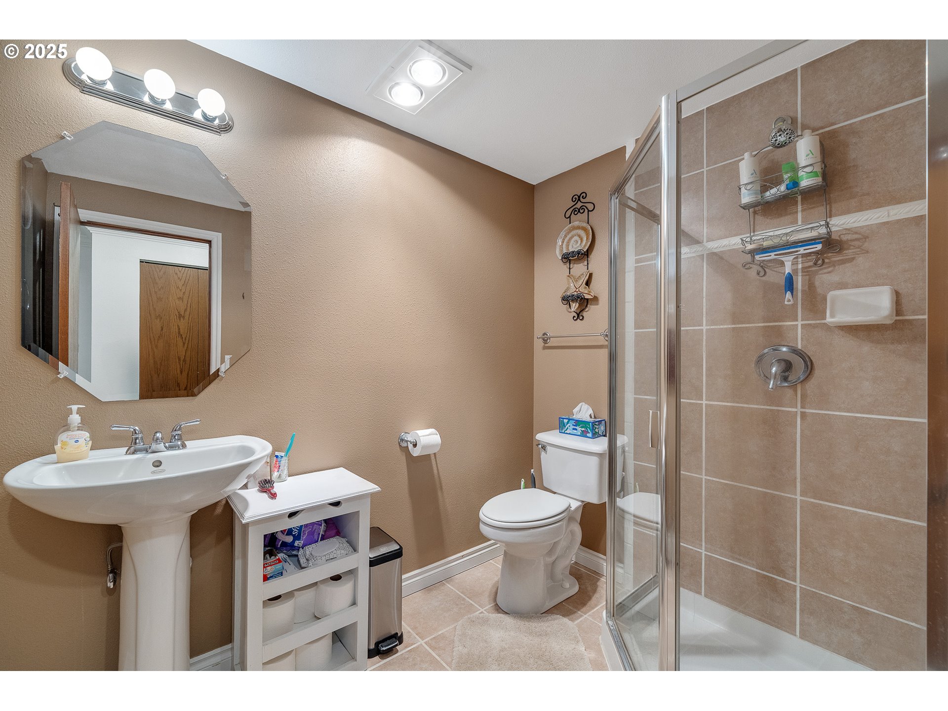 9065 Trask River Road Tillamook, OR 97141 - Photo 8 of 48 a bathroom with a sink toilet and shower