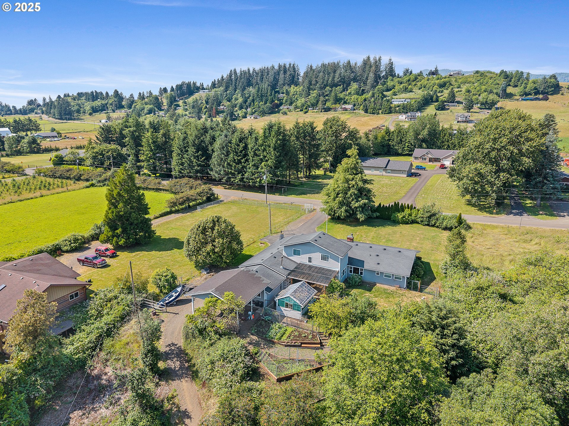 9065 Trask River Road Tillamook, OR 97141 - Photo 9 of 48 an aerial view of a house with a garden