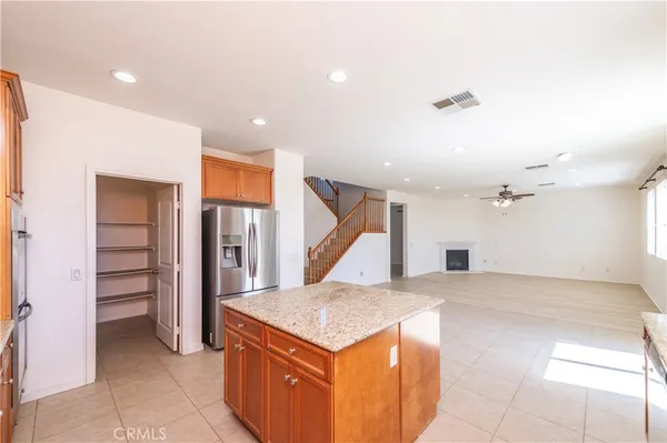 a kitchen with a stove and a refrigerator