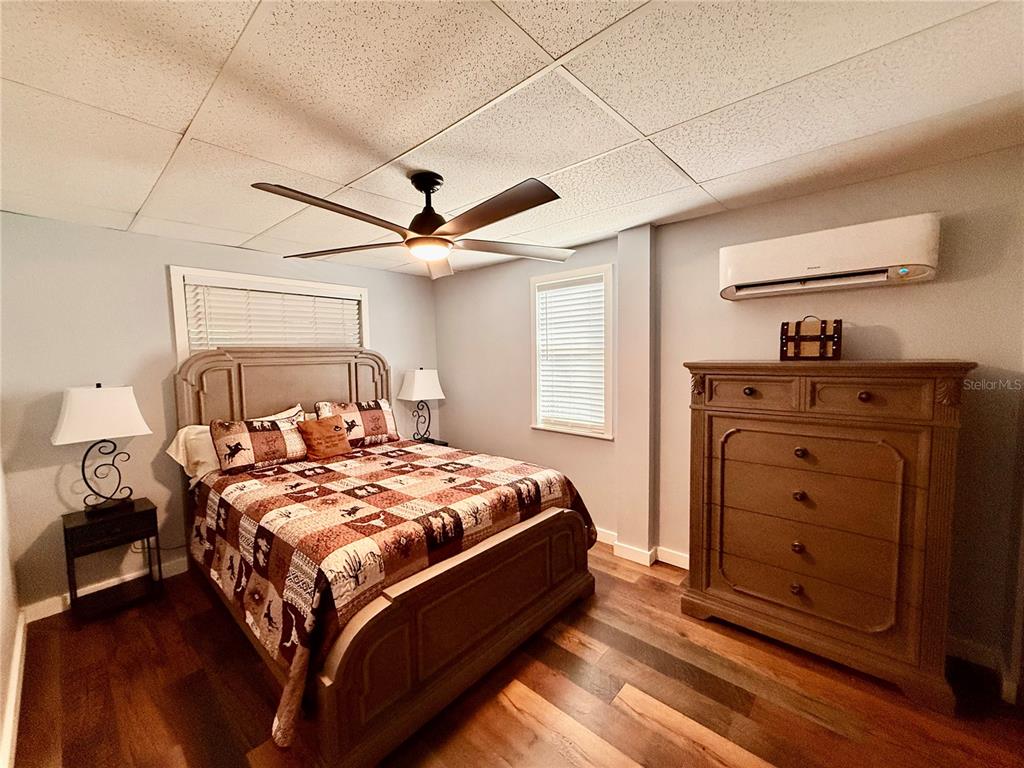61 Perch Street Haines City, FL 33844 - Photo 23 of 79 a bed room with a bed and a dresser