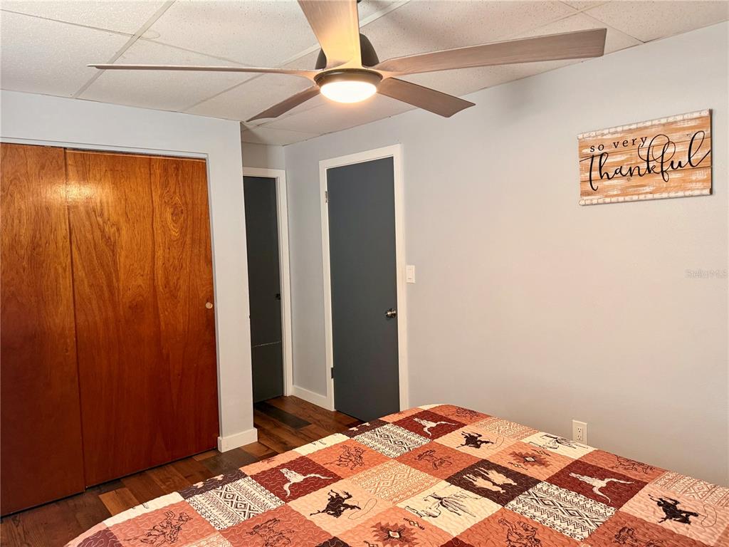 61 Perch Street Haines City, FL 33844 - Photo 24 of 79 a bedroom with a bed and a dresser