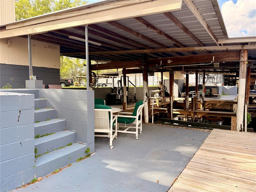 61 Perch Street Haines City, FL 33844 - Photo 39 of 79 a view of a chairs and tables in the patio