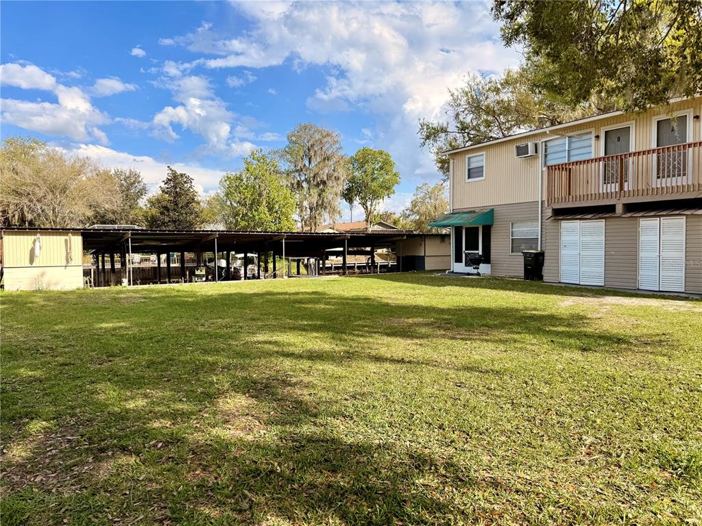 61 Perch Street Haines City, FL 33844 - Photo 47 of 79 a view of a house with a big yard