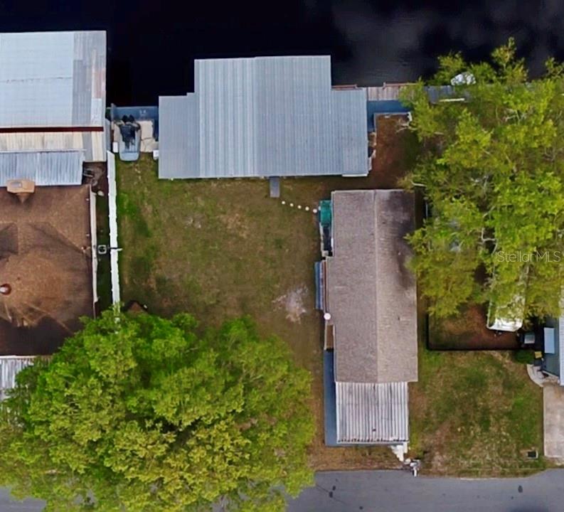 61 Perch Street Haines City, FL 33844 - Photo 51 of 79 an aerial view of a house with a yard