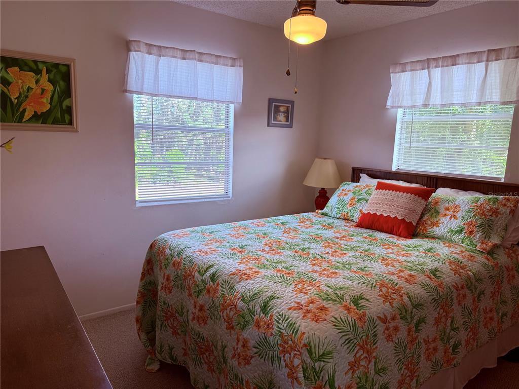 61 Perch Street Haines City, FL 33844 - Photo 62 of 79 a bedroom with a bed and window