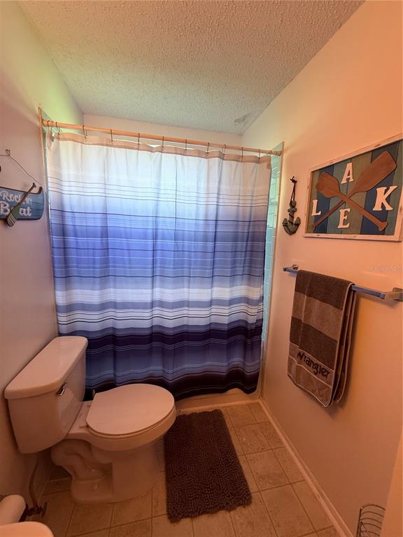 61 Perch Street Haines City, FL 33844 - Photo 76 of 79 a bathroom with a toilet a sink and shower