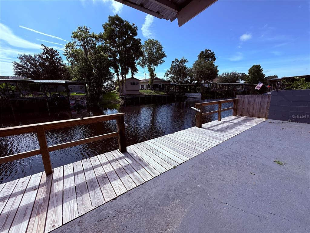 61 Perch Street Haines City, FL 33844 - Photo 78 of 79 a view of deck with lake and covered with trees in the background