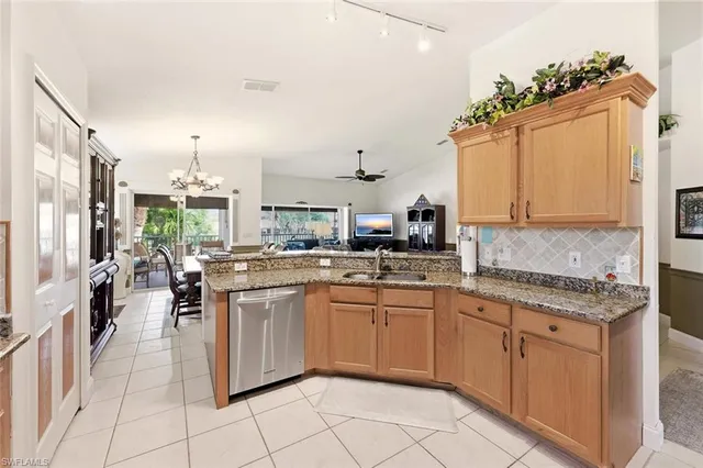 a kitchen with a sink counter top space and cabinets