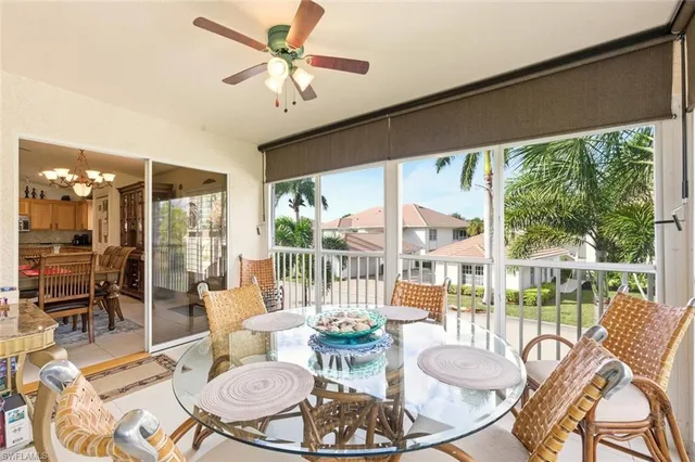 a view of a city from a dining room with large windows