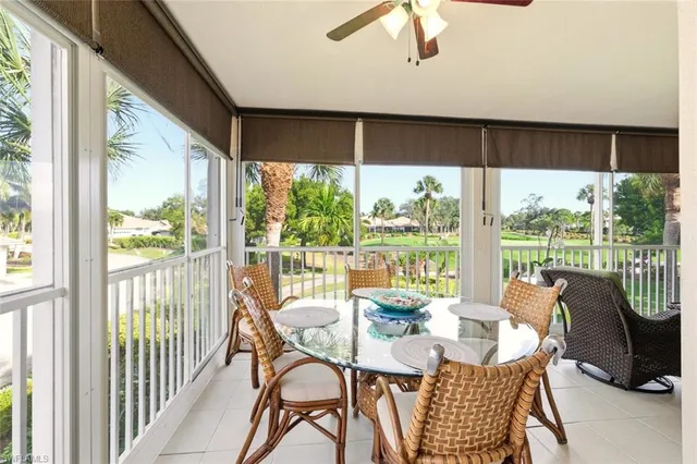 a view of swimming pool with outdoor seating and plants