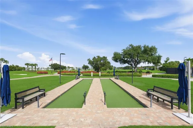 a patio with a table and chairs