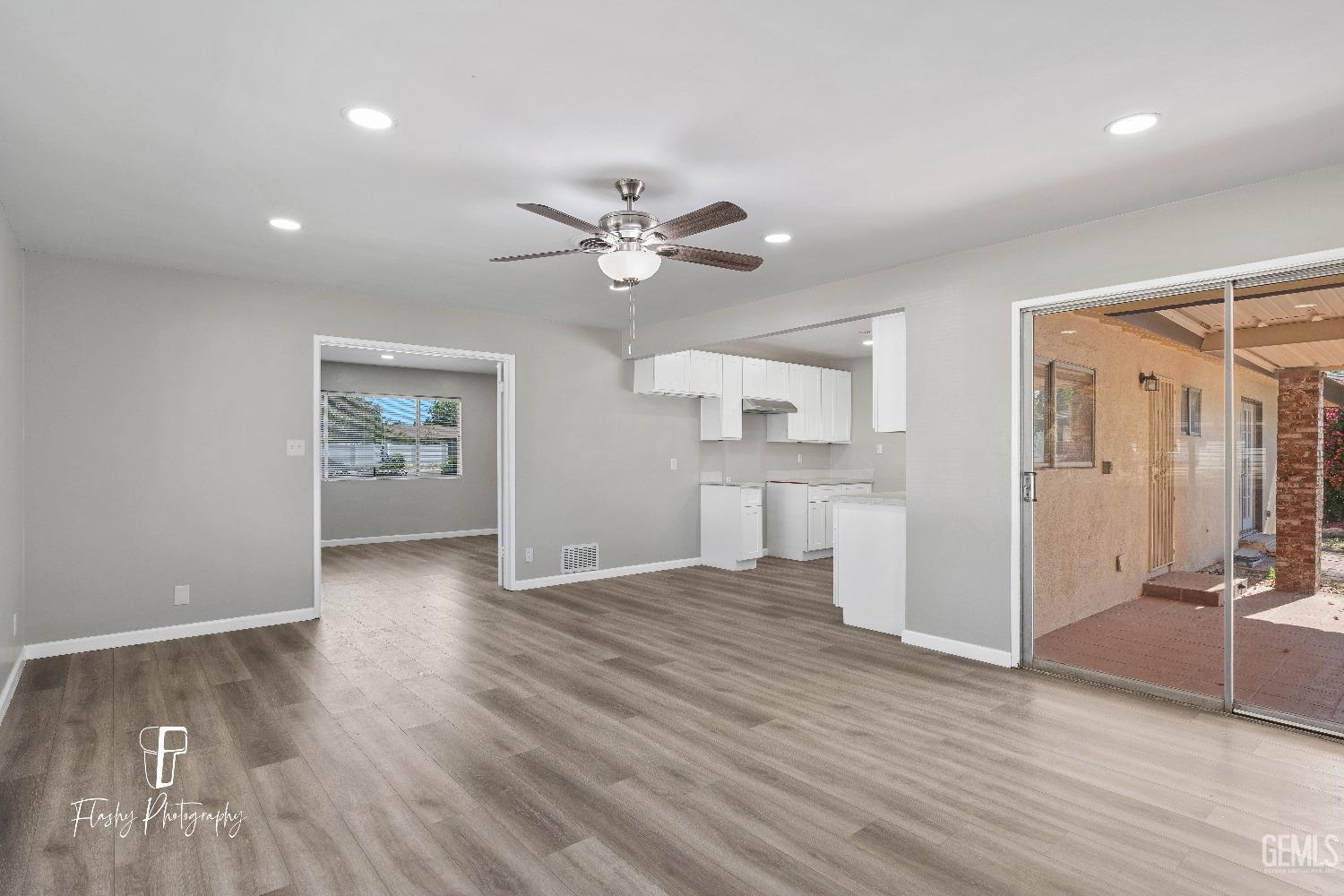 Undisclosed Address Bakersfield, CA 93308 - Photo 12 of 37 wooden floor in an empty room with a window