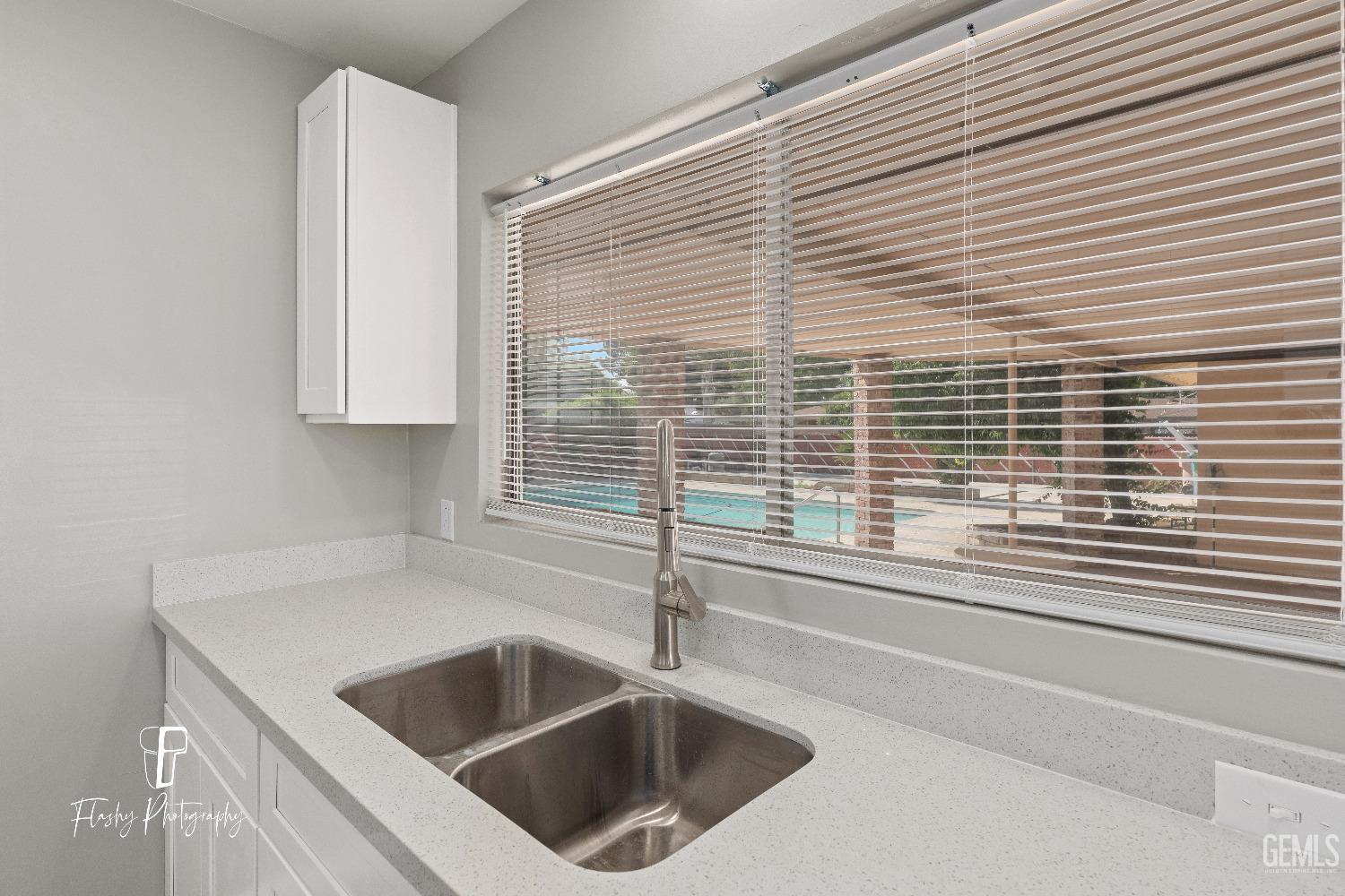 Undisclosed Address Bakersfield, CA 93308 - Photo 16 of 37 a kitchen with a sink and a window