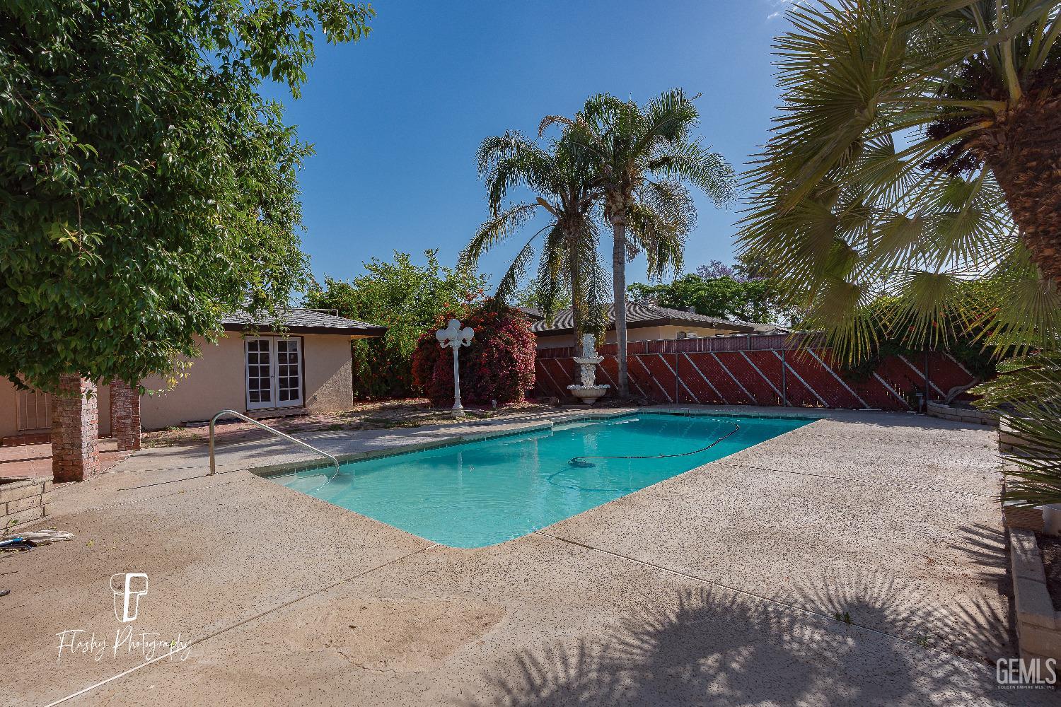 Undisclosed Address Bakersfield, CA 93308 - Photo 35 of 37 a view of a house with garden and a tree