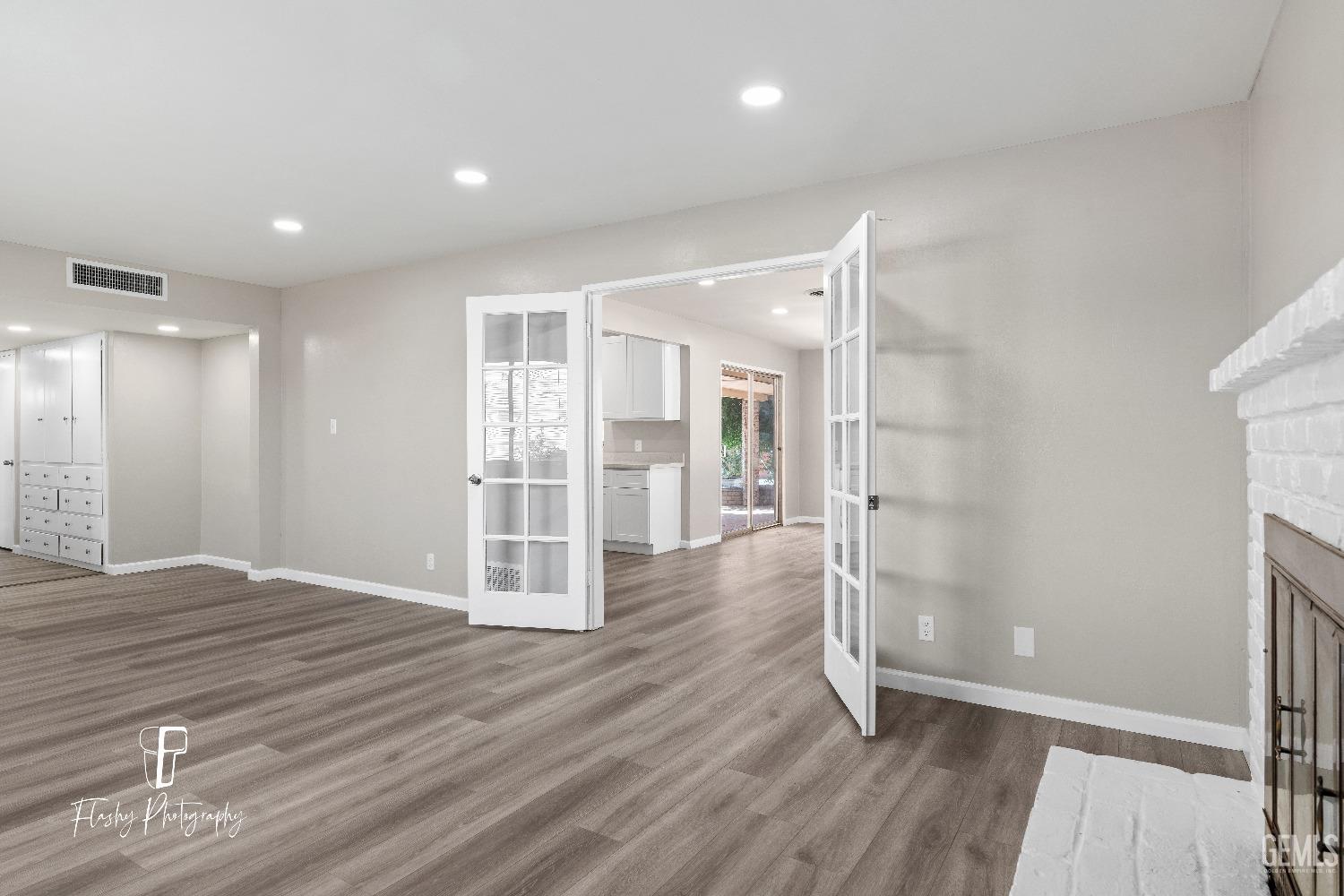 Undisclosed Address Bakersfield, CA 93308 - Photo 7 of 37 a view of empty room with wooden floor